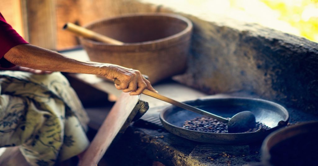 Traditional method of coffee roasting on a civet coffee farm in Indonesia. Coffee is produced from beans that have been eaten and defecated by civets. Also known as Kopi Luwak, this type of coffee is famous for its non-acidic, smooth taste and is one of the most expensive coffees in the world.